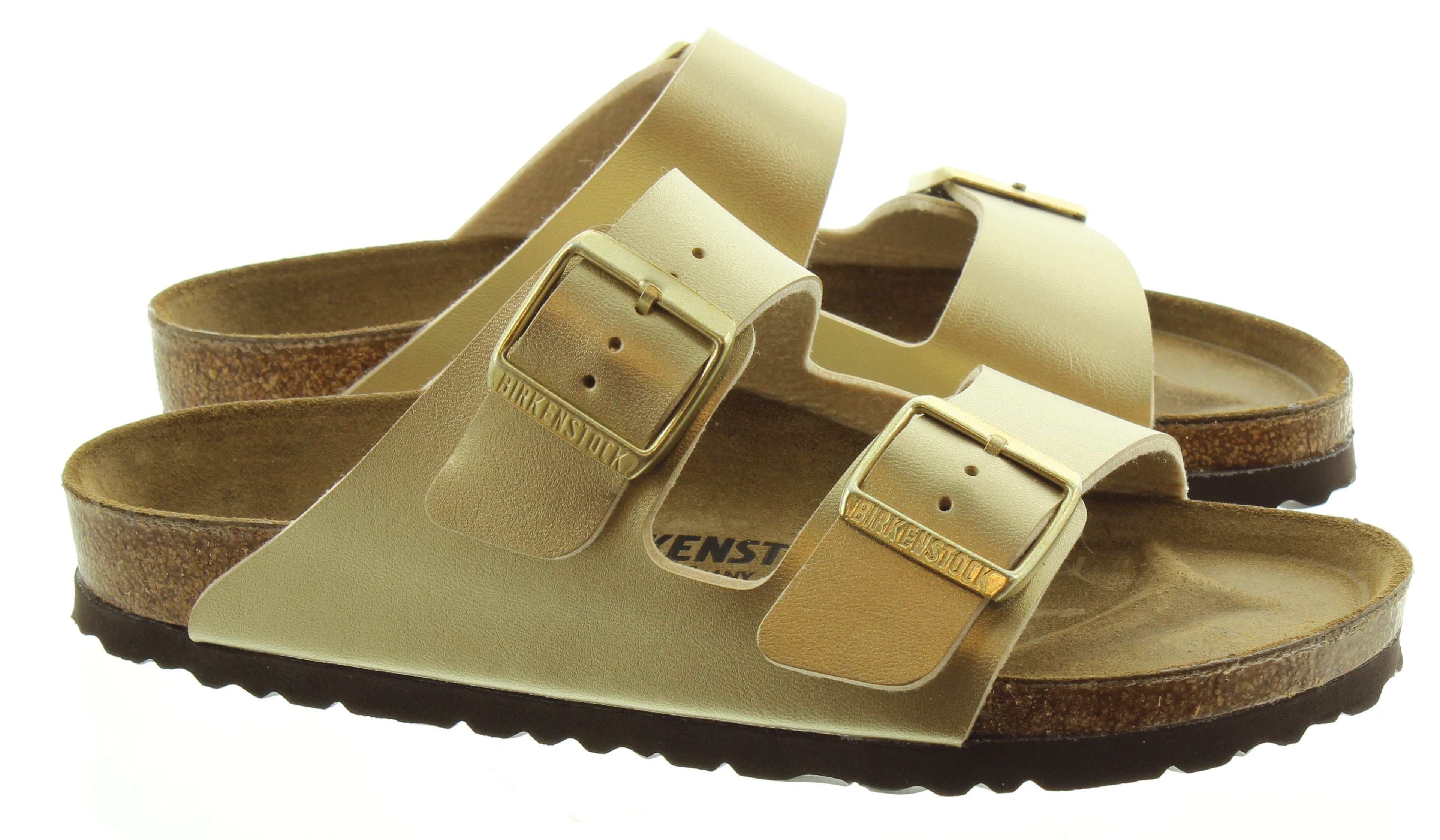 BIRKENSTOCK WOMENS BIRKENSTOCK ARIZONA 2 BAR MULE SANDALS IN GOLD